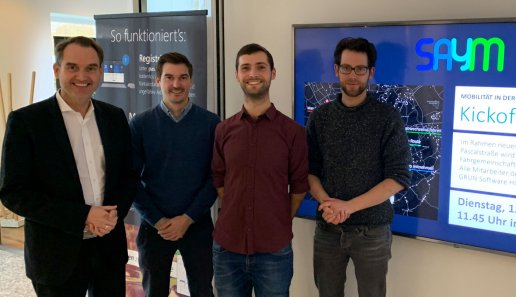 Dr. Oliver Grün, Board Member and CEO of GRÜN Software AG with Benjamin Dörries (COO), Daniel Bogdoll (CEO) and Philipp Uhl (UI / UX Design) from SAYM (from left to right).